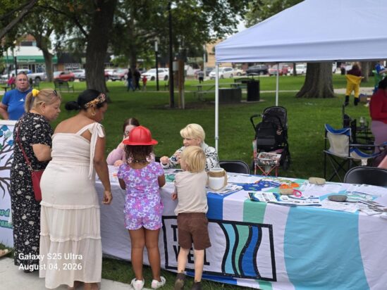 Families visiting The Well's table at Columbus National Night Out
